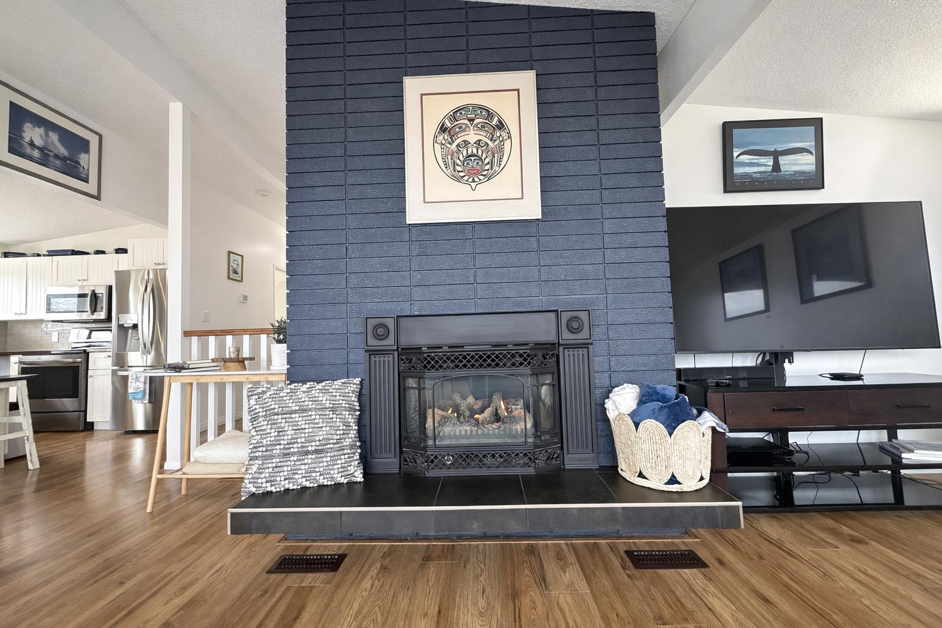 Living room with blue brick fireplace